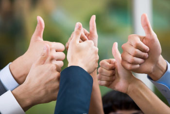 A group giving of thumbs up
